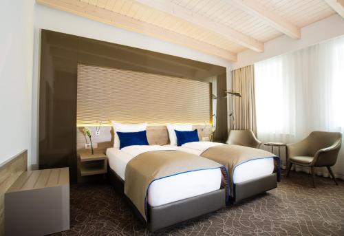 Postel nebo postele na pokoji v ubytování Hotel Atlas Leipzig