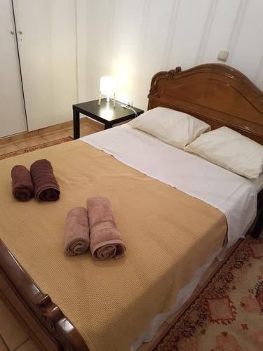 Posteľ alebo postele v izbe v ubytovaní Filopappou Hill Apartment