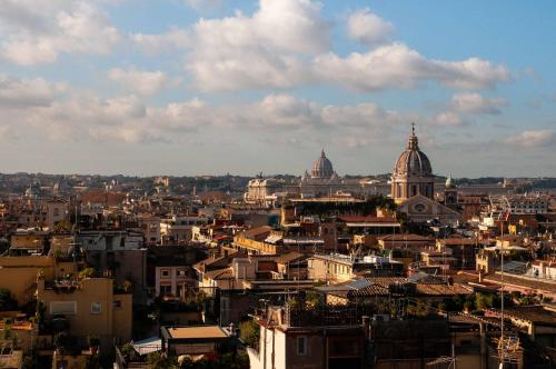 a view of a city with domes in the background at Hotel Scalinata Di Spagna in Rome