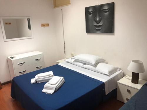 Un pat sau paturi într-o cameră la Al Torrione B&B