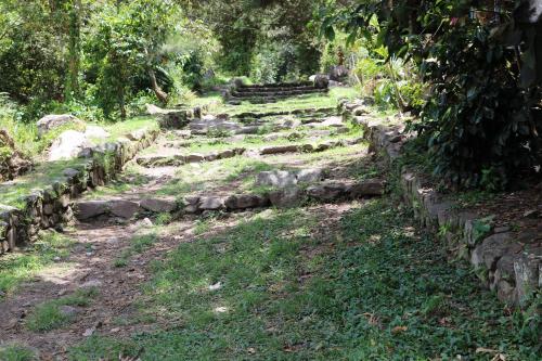 a set of stone steps in a garden at Llactapata Lodge overlooking Machu Picchu - camping - restaurant in Salcantay