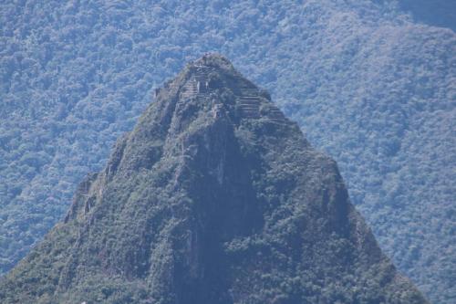 a large mountain with trees on top of it at Llactapata Lodge overlooking Machu Picchu - camping - restaurant in Salcantay