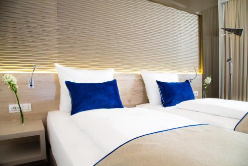 Postel nebo postele na pokoji v ubytování Hotel Atlas Leipzig