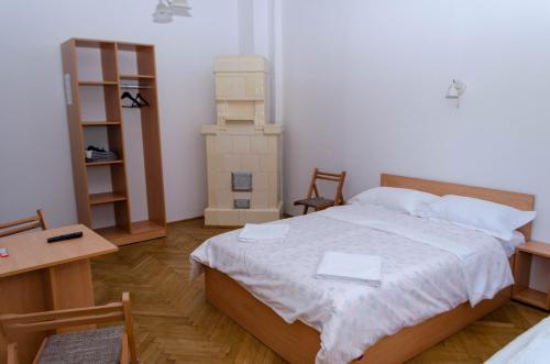 Postel nebo postele na pokoji v ubytování Casa Rezidentiala Pasteur