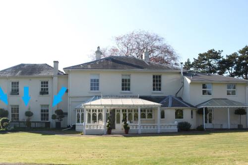 a large white house with a gazebo at Dean End Apartment 2 in Ross on Wye