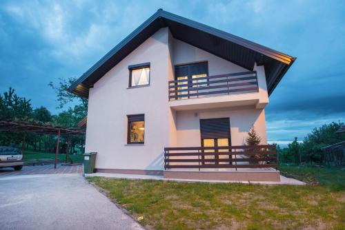 a small house with a black roof at Holiday Home Dandelion with Hot Tub & Sauna in Cetingrad