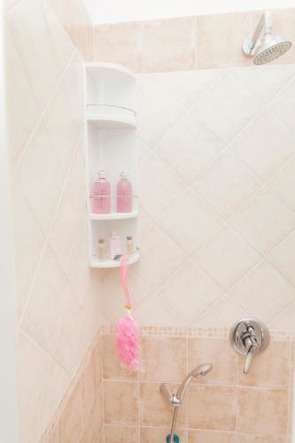 a bathroom with a shower with a faucet at Bed & Breakfast Santa Caterina in Ercolano
