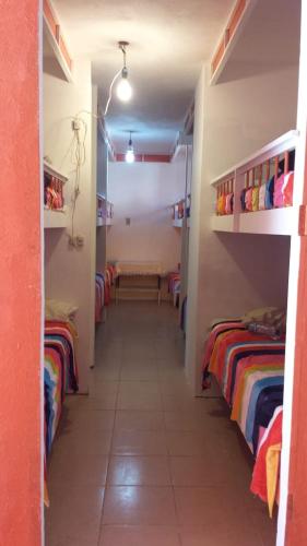 a hallway of a dorm room with three bunk beds at Mi casita en puebla in Puebla