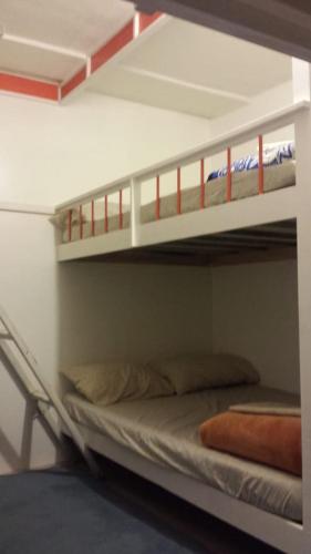 two bunk beds in a room with a bed at Mi casita en puebla in Puebla