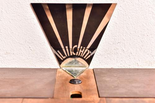 a mirror on top of a wooden table at The Old Town Flat in Murten