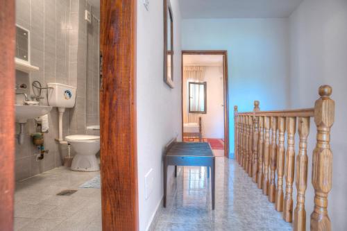 a bathroom with a staircase with a toilet and a stair case at Apartments Đurašević Ivo in Sveti Stefan