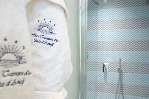 a refrigerator with paper towels in a room at Tramonto d'Oro in Praiano