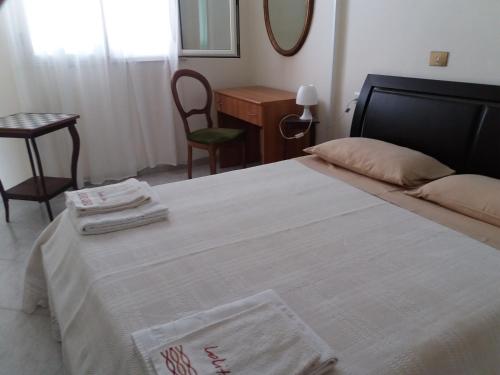 Ένα ή περισσότερα κρεβάτια σε δωμάτιο στο B&B Villa Pegaso