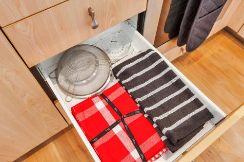 an open drawer with two ties in a cabinet at QV Waterfront Magic Super Sunsets - 742 in Auckland