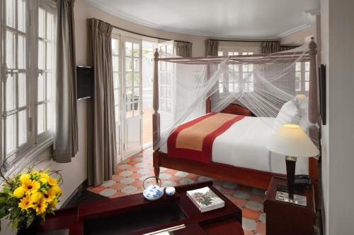 
Ein Bett oder Betten in einem Zimmer der Unterkunft Azerai La Residence, Hue
