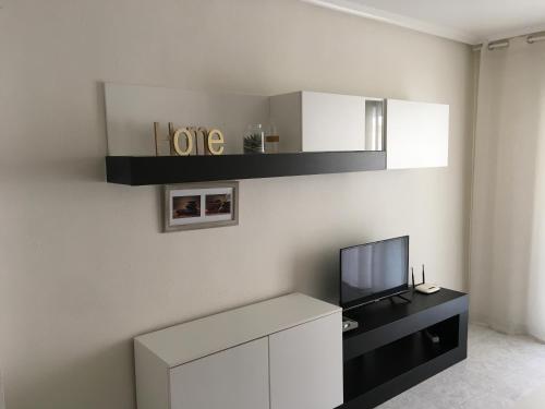 En TV eller et underholdningssystem på Apartamento Acequion