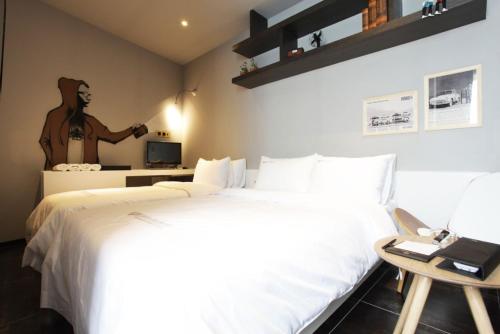 Cama ou camas em um quarto em Benikea Rich Diamond Hotel