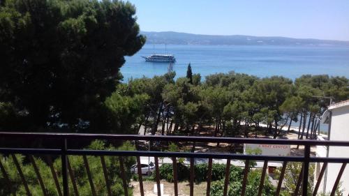 a cruise ship in the water from a balcony at Summerhouse Duće Omiš in Duće