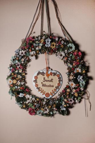 a heart shaped wreath with flowers on a wall at Ekaterinoslav in Dnipro
