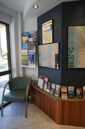 a waiting room with a desk and a chair at City Waters in Perth