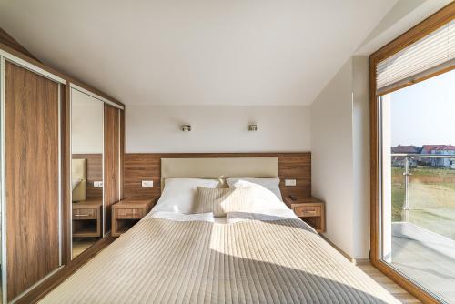 Postel nebo postele na pokoji v ubytování Apartamenty i Pokoje Gościnne Relax