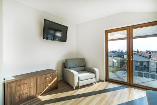 TV a/nebo společenská místnost v ubytování Apartamenty i Pokoje Gościnne Relax