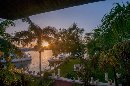 a view of a body of water with a boat at Hotel Tilapia in Mwanza