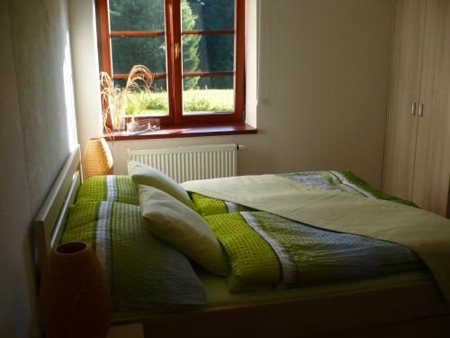 Postel nebo postele na pokoji v ubytování Apartmán Zlatá Vyhlídka