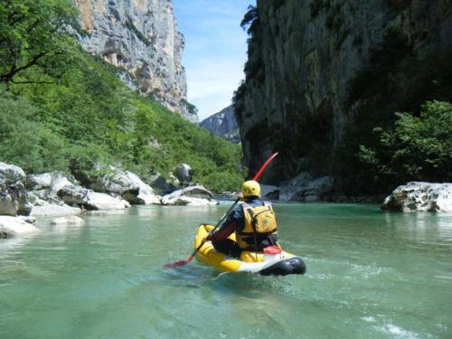 a person in a raft in a river at Camping Rives du Lac de Sainte Croix in Bauduen