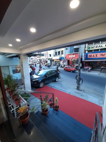 a car parked on a street in a city at Liza Regency in Chennai