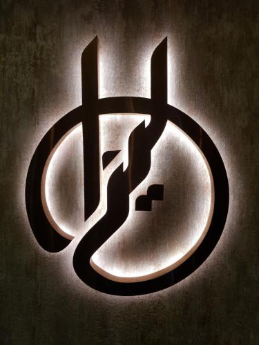 a sign with two crosses on a door at Liza Regency in Chennai