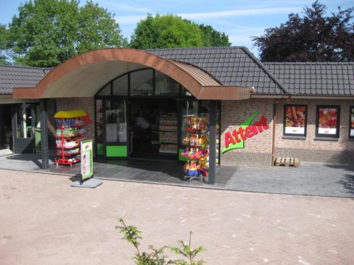 a store with an archway in front of a building at Groepsboerderij 20 pers. in Voorthuizen