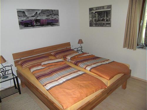 Postel nebo postele na pokoji v ubytování Ferienwohnung am Rosengarten