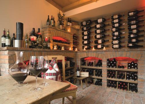 a wine cellar with two glasses of wine at Hotel Montana in Sankt Anton am Arlberg