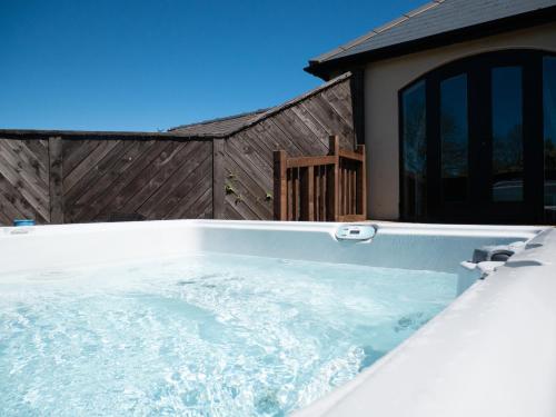 a hot tub in the backyard of a house at South Causey Inn in Stanley