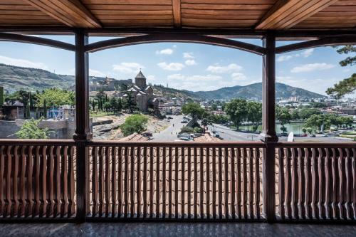 a view of a city from a balcony at Hotel Kopala in Tbilisi City