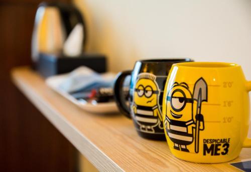 two mugs are sitting on a counter top at Sky Young Homestay in Hengchun