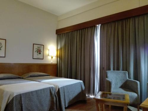 Postel nebo postele na pokoji v ubytování Hotel Do Centro