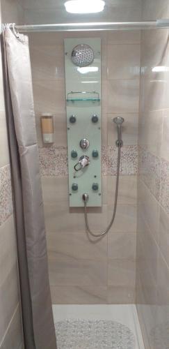 a bathroom with a shower with a glass door at Made in You - Oporto Rooms in Porto