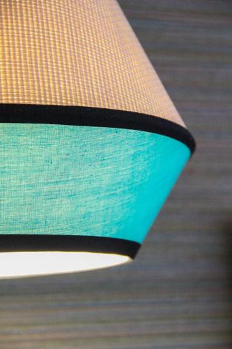 a close up of a light fixture with a green at Hotel Verdemar in Ribadesella