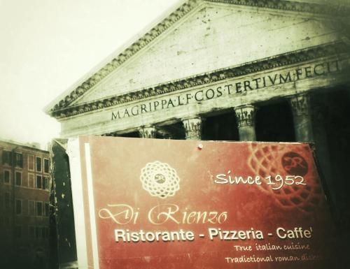 a sign in front of a building at Di Rienzo Pantheon Palace in Rome
