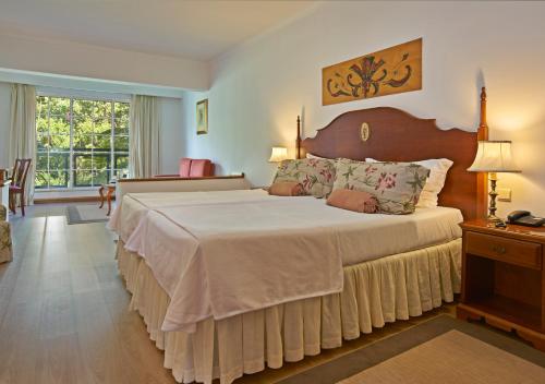 Letto o letti in una camera di Quintinha Sao Joao Hotel & Spa