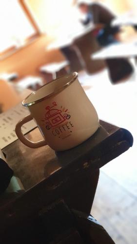 a coffee cup sitting on top of a table at Leśna Willa PTTK w Komańczy in Komańcza