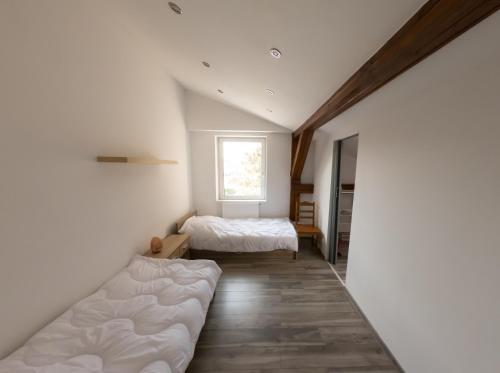 a bedroom with two beds and a window at Apartamenty blisko dworca PKP,PKS in Cieszyn
