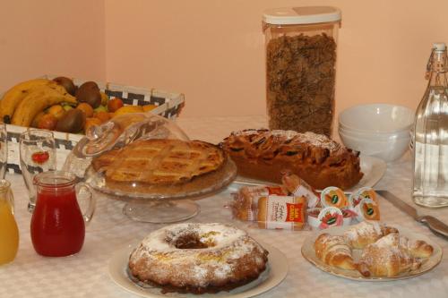 a table with many different types of food on it at Il Principe B&B in Ali Terme