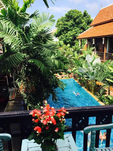 a view of the pool from the balcony of a resort at Hongkhao Village in Chiang Mai