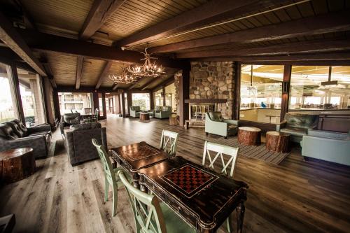 a living room with a wooden table and chairs at Lake Lawn Resort in Delavan