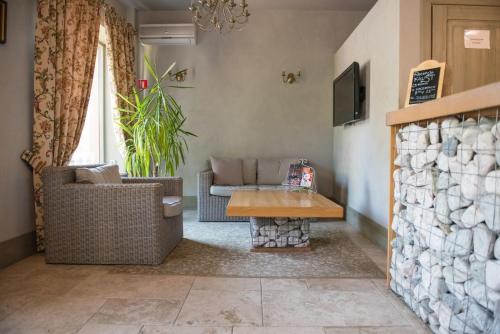 a living room with a couch and a table at Apartamenty Faust in Ełk