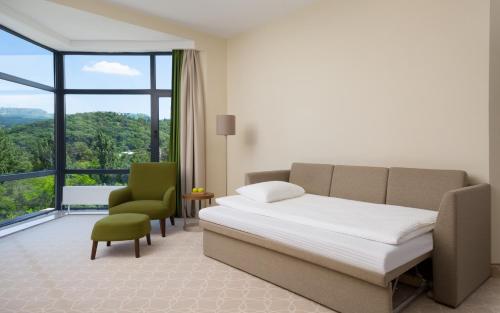 Postel nebo postele na pokoji v ubytování Green Resort Hotel and SPA