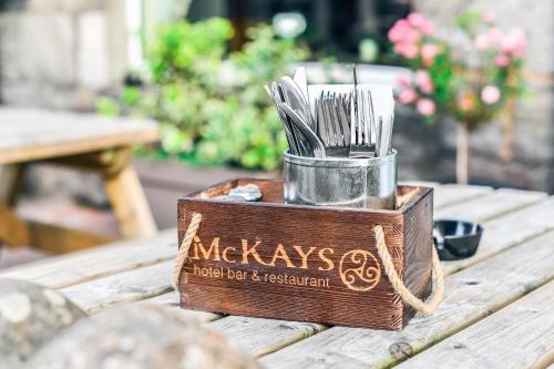 
a pair of scissors on a wooden bench at McKays Hotel in Pitlochry
